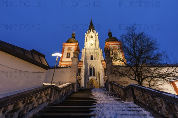 Snow on staircase, facade of the pilgrimage church, basilica of Mariazell, blue hour in the early morning, Mariazell, Styria, Austria, Europe