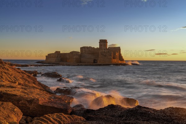 Le Castella, Italy, 11 December, 2023: view of the Le Castella fortress in Isola di Capo Rizzuto at sunset, Europe