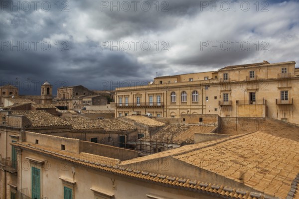 Above the rooftops before storm in Noto in Sicily