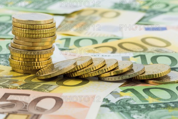 Single stack of coins, lying coins, symbolic photo for capital investment, risk and profit collapse Austria