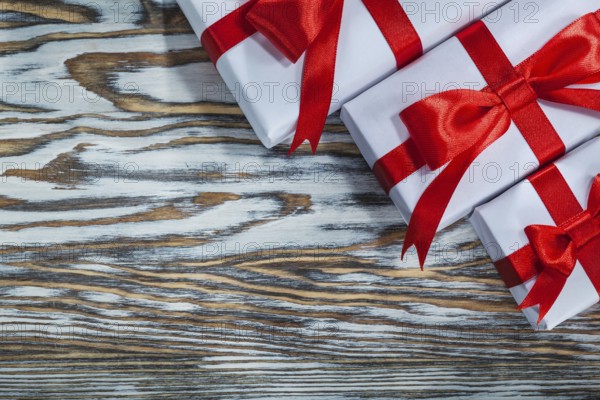 Red packed present boxes on wooden surface