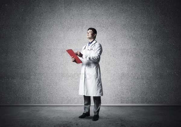 Portrait of the Doctor. Holds a tablet with documents in his hands and makes notes