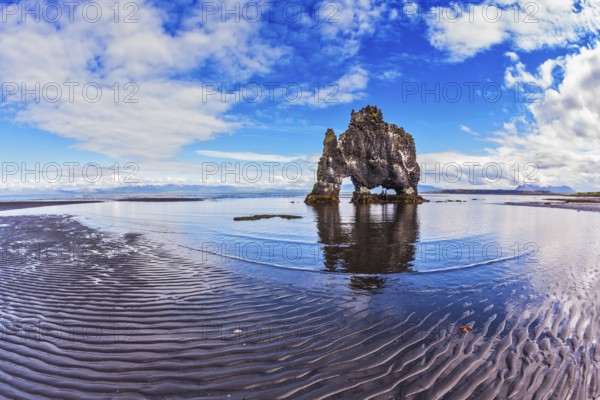 Stone mammoth Iceland. The picturesque cliff in Bay of Hoonah. Hvitserkur rocks during low tide at sunset