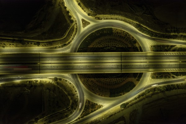 Aerial drone top view of motorway junction. Roundabout with cars moving. Transportation infrastructure, Nicosia Cyprus