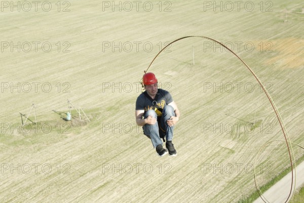Jumping with a rope.extreme man jumping from a great height.jumping with a rope.flying down on the rope.engage in rope jumping.dangerous hobbies