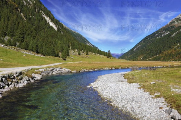 Austrian Alps. Headwaters of the famous Krimml waterfalls. The crystal clear transparent water glows in the midday sun