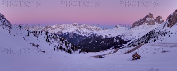 Winter landscape in Passo Role before sunrise in winter
