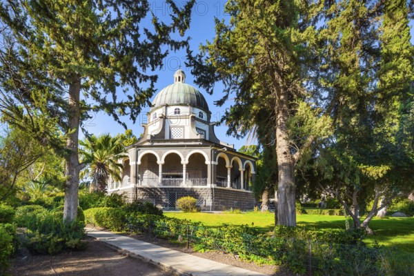 Blooming huge park around the monastery. The Lake Tiberias. Church of the Beatitudes. The church is octagonal in honor of the eight Beatitudes. The concept of religious pilgrimage and photo tourism