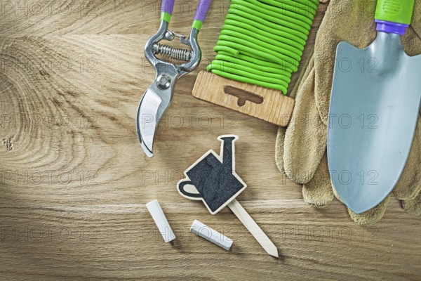 Safety gloves shovel soft twist tie secateurs chalkboard price sign tag agriculture concept