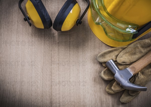 Claw hammer safety glasses protective gloves hard hat ear muffs