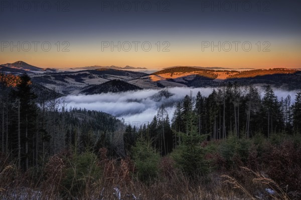 Fog over the Liptov village of Velke Borove before sunrise by Liptovska Mara in Slovakia