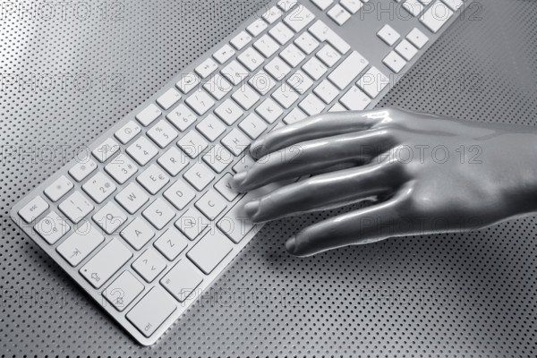 Computer keyboard aluminum gray hand silver background