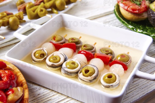 Olives anchovies and picked onion red pepper pinchos tapas from Spain