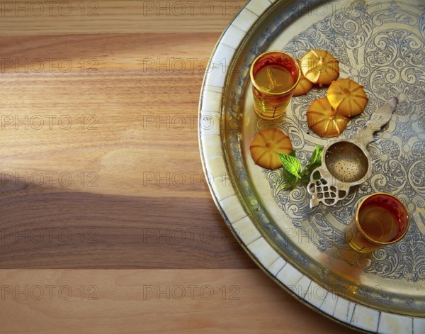 Green tea with mint Moroccan style on silver tray and biscuits