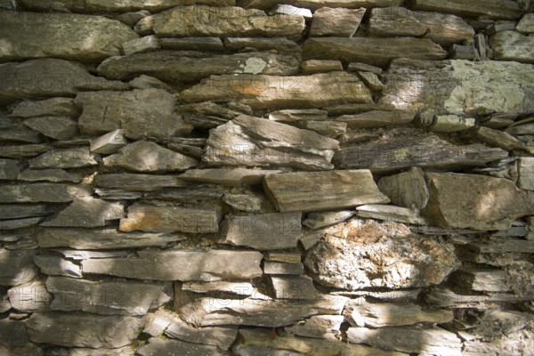 Old stone wall made with the technique of dry masonry
