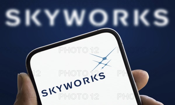 skyworks logo is displayed on smartphone. Skyworks Solutions Inc is an American semiconductor company.