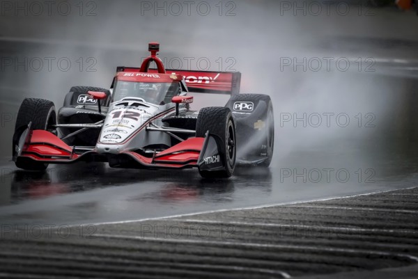 WILL POWER (12) of Toowoomba, Australia comes through turn 12 (Canada Corner) during a wet practice session for the XPEL Grand Prix at Road America in Elkhart Lake, WI
