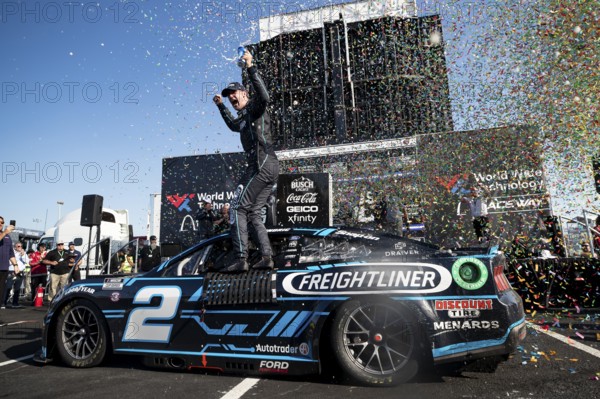 Austin Cindric celebrates after winning the Enjoy Illinois 300 at the World Wide Technology Raceway in Madison IL