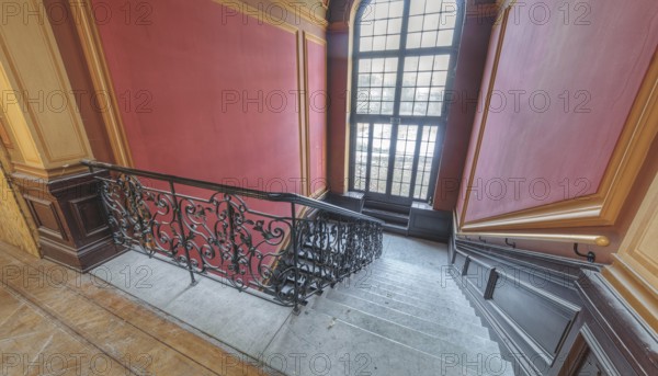 Elegant interior with curved staircase, red walls and large window, Villa Woodstock, Lost Place, Brill, Wuppertal, North Rhine-Westphalia, Germany, Europe