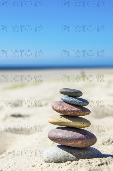 Round pebbles on the beach in Denmark is a symbol for balance. Stones on the beach in Denmark is a symbol for balance