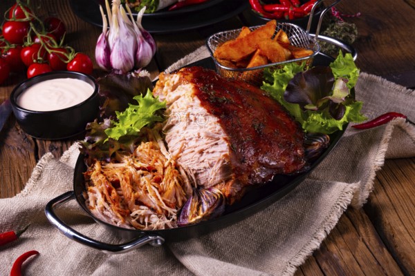 Delicious pulled pork with jacket potato quarters