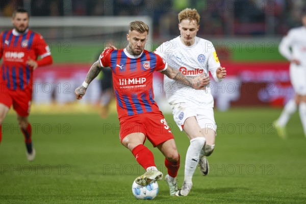 Football, Bundesliga 1, Matchday 26, 2024/2025, 1. FC Heidenheim vs. Holstein Kiel, 16/03/2025, Voith-Arena, Heidenheim, Germany, Finn PORATH (Holstein Kiel, 08) in duel with Niklas DORSCH (1. FC Heidenheim, 39), Europe