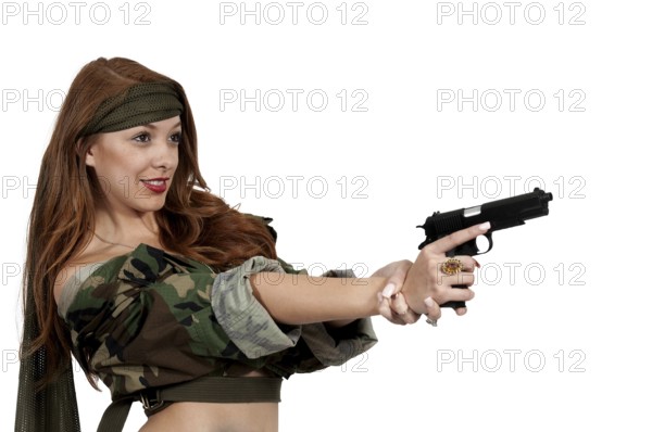 Gun toting beautiful young woman soldier with a pistol