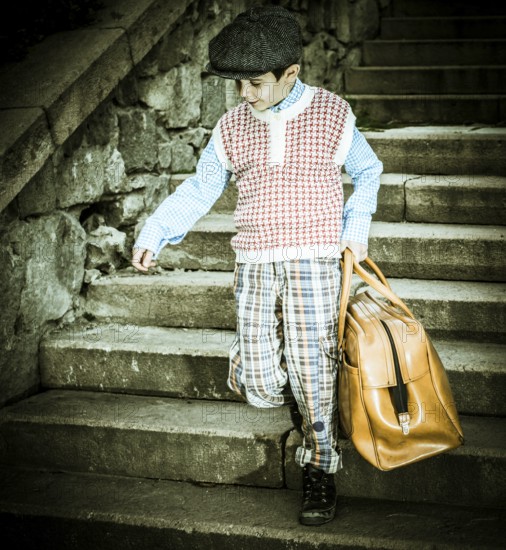 Exterior stairs and child with vintage bag. Vintage clothes style