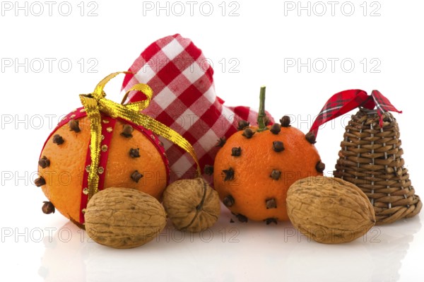 Christmas still life with orange cloves and walnuts