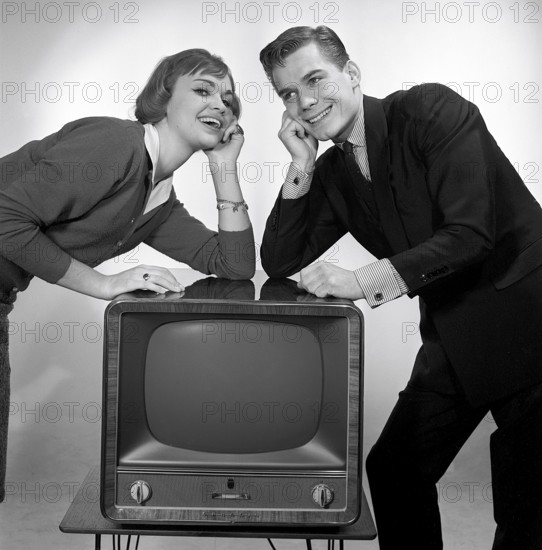 Television in the 1950s. A young couple is pictured beside a typical 50s television set. Photo Kristoffersson ref CC93-3. Sweden 1958