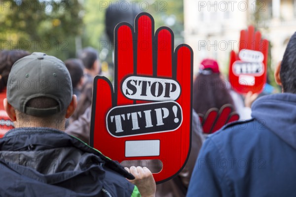 Activists are holding red hand signs Stop TTIP during a demonstration against Free Trade Agreements TTIP, CETA and TISA between EU and U.S. in Sofia, Bulgaria, Europe