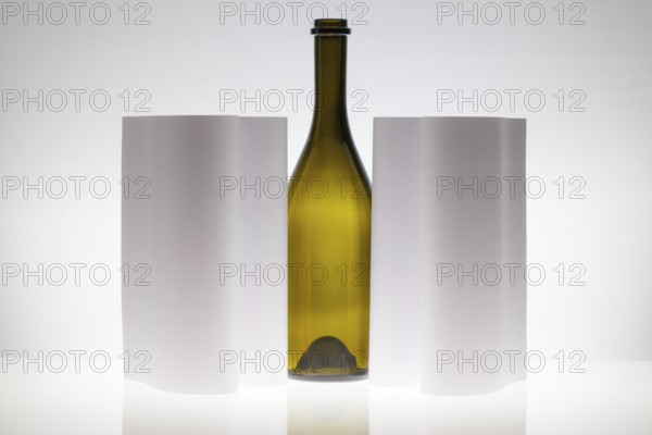 Symmetry abstract Paper Background with green glass on a glass table