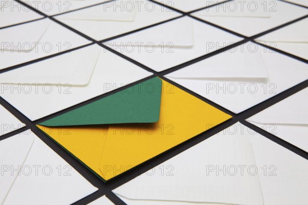 Composition with white and colored envelopes on the table. The photo suitable for various holidays and anniversaries