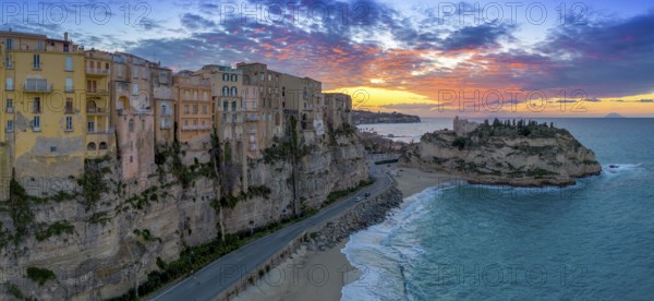 Tropea, Italy, 16 December, 2023: panorama view of Rotonda Beach and the colourful old town of Tropea in Calabria at sunsetview of Rotonda Beach and the colourful old town of Tropea in Calabria, Europe