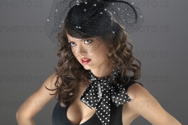 A photo of the confused beauty with the woven hat