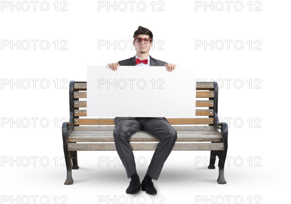 Young businessman holds a large white banner. sits on the bench