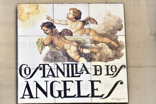 Madrid, Spain, Europe, An artistically painted street sign on a wall shows the Costanilla de los Angeles in Madrid, Europe