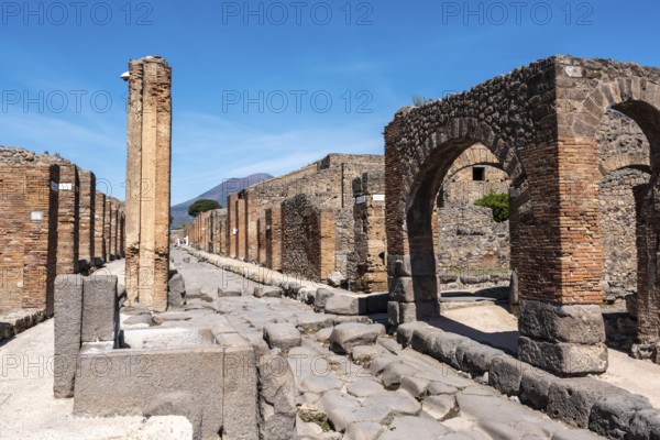 POMPEII, ITALY, MAY 04, 2022, A crosswalk of a typical Roman road in the ancient city of Pompeii, Southern Italy