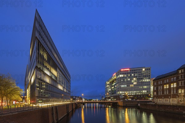 Modern office buildings reflect in the water at night, illuminated by numerous lights, Blue Hour, Deichtor Centre, Free and Hanseatic City of Hamburg, Germany, Europe