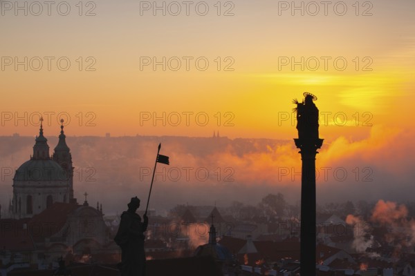 The Church of St.Nicholas in the mist. Prague, Czech Republic.This is the most famous Baroque church in Prague, stands along with the former Jesuit college in the centre of the Lesser Town Square