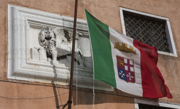 Italy Venice Museo Storico Navale -189 Maritime Museum at Campo San Biásio Façade section with relief of St Mark's lion and Italian naval flag