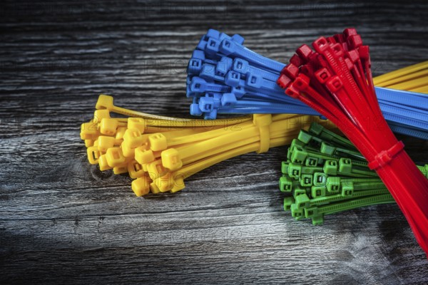 Set of plastic cables on vintage wooden board