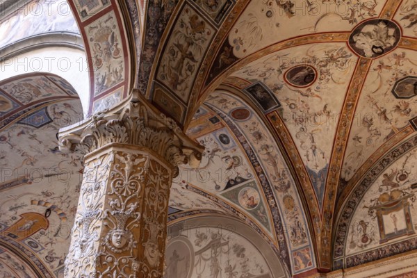 Wall frescoes of rich decorated courtyard of Palazzo Vecchio in Florence, Italy, Europe