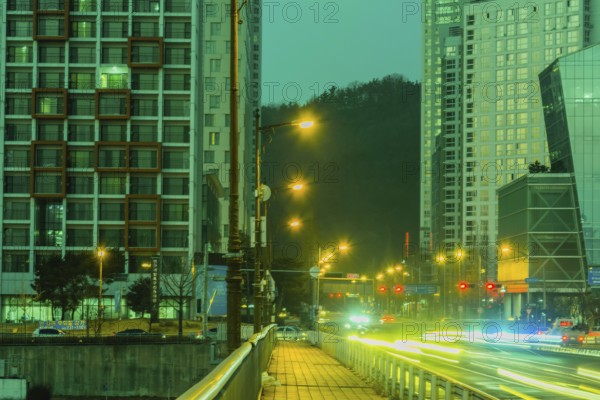 Daejeon, South Korea, January 17, 2019, Night cityscape of traffic at busy intersection with modern highrise buildings in background, Asia