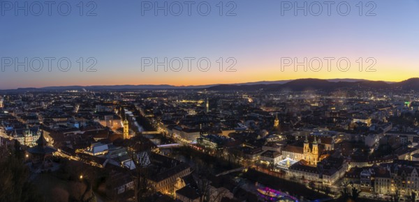 Evening mood, view from the Schlossberg to the illuminated Murinsel and the Mariahilferkirche, panoramic shot, historic city centre of Graz, Styria, Austria, Europe