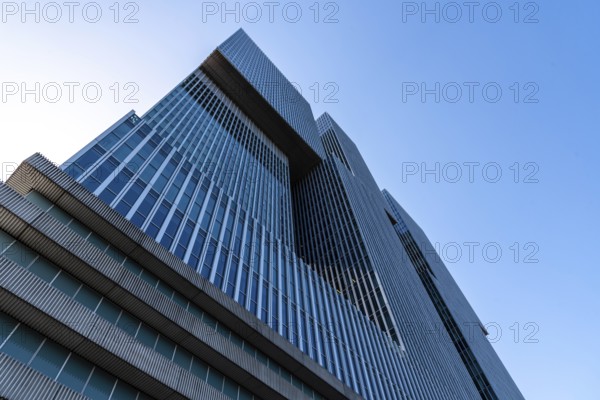 Rotterdam, Netherlands, May 8, 2022: De Rotterdam Skyscraper against sky. Designed by Rem Koolhaas architect. Contemporary architecture. Low angle view