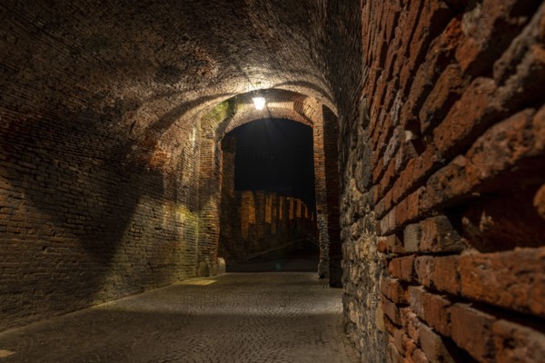 Medieval Passage to the old Castelvecchio Bridge over the Adige River at Night, Verona, Italy, Europe