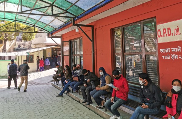 Kathmandu, Nepal, 16 March 2020: People wearing protecting masks outside a hospital, waiting for checkup for coronavirus and other health diseases at Kathmandu in Nepal. Asia, Asia