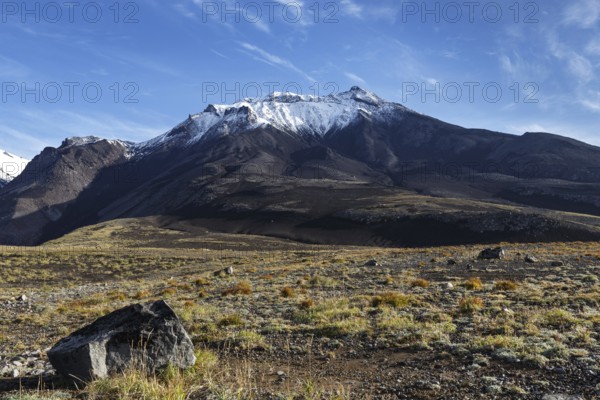 Beautiful volcanic landscape of Kamchatka Region: autumn view of Kozelsky Volcano on background of blue sky. Avachinsky-Koryaksky Group of Volcanoes, Kamchatka Peninsula, Russian Far East, Eurasia