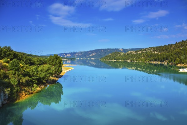 Verdon Canyon - the most spectacular in the French Alps. Spring Provence. Azure water reflects the clouds